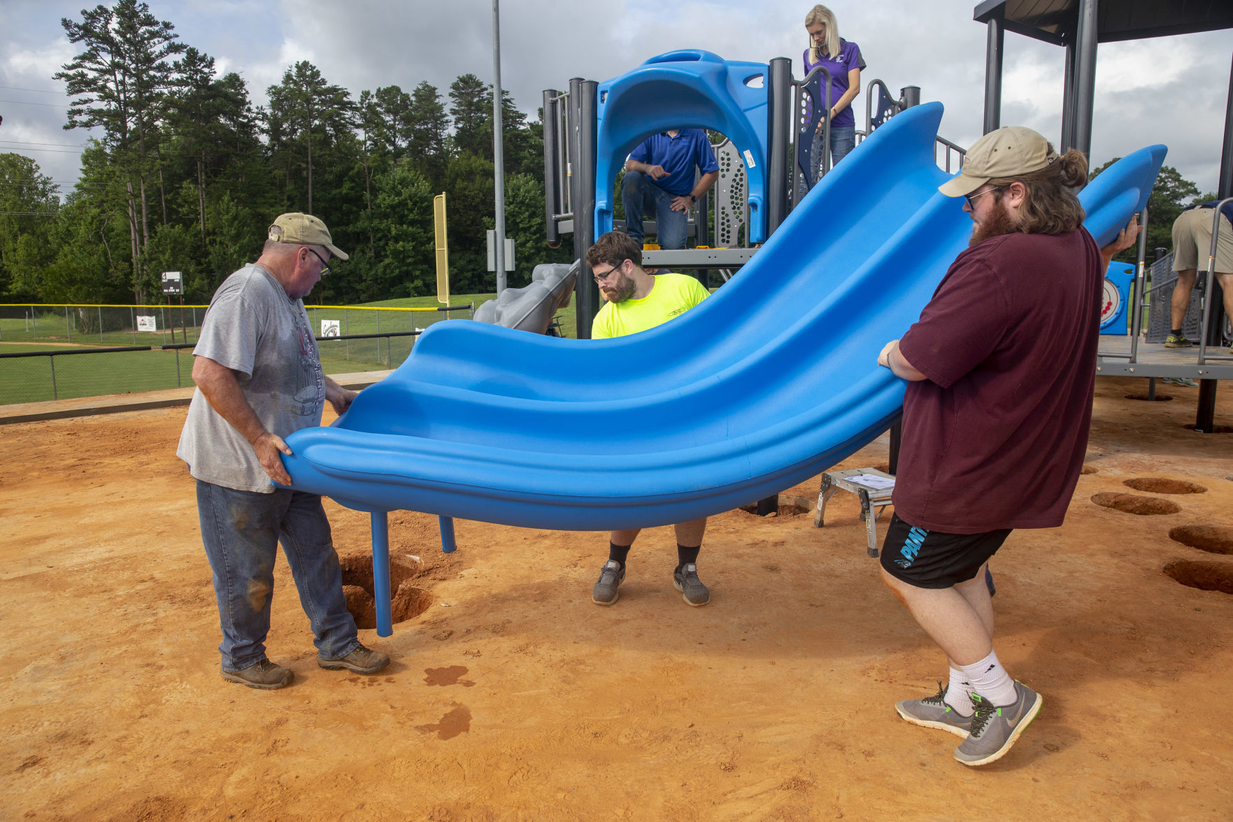Volunteers assemble playground